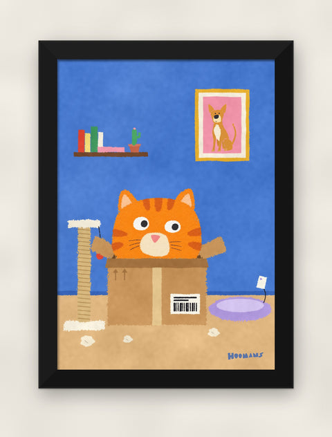Orange Tabby in the Box art print in a black frame on a plain wall, front view