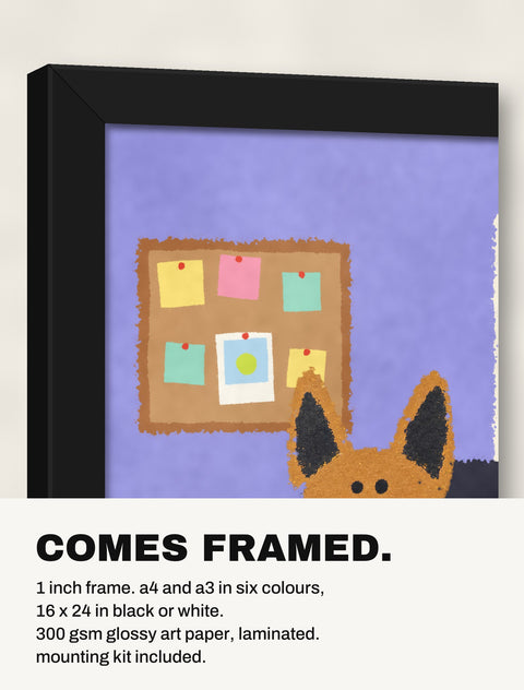 Corner of the black frame at an angle showing the German Shepherd at the Desk print inside