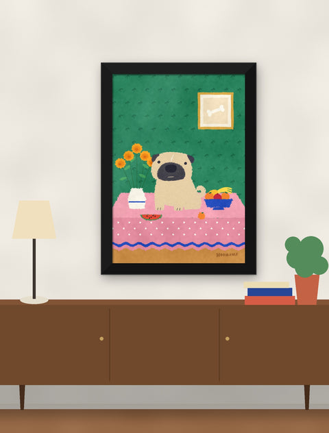 Black framed pug poster hung above a walnut console with a lamp, books and a plant