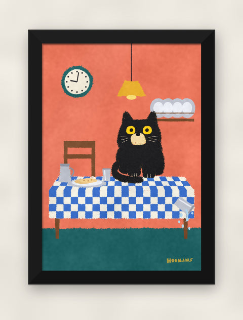 Black Cat on the Dinner Table art print in a black frame on a plain wall, front view