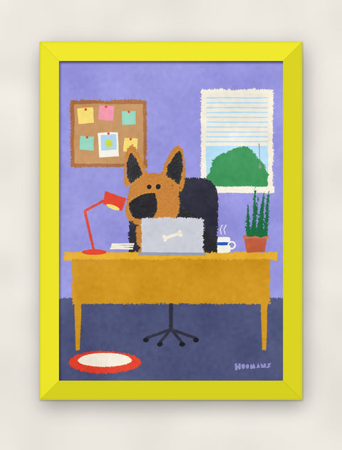 German Shepherd at the Desk art print in a yellow frame on a plain wall