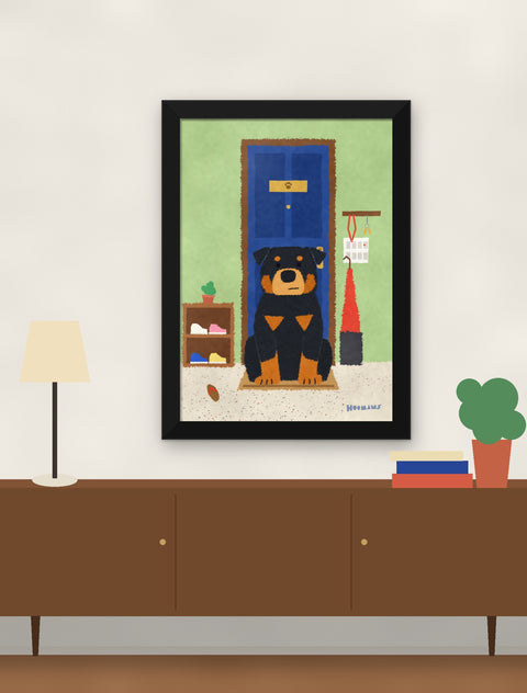 Black framed rottweiler poster hung above a walnut console with a lamp, books and a plant
