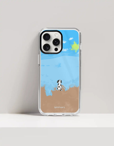 Hoomans Out of Office iPhone case — hand-painted spotted dog on a beach facing the sea, on iPhone 15 Pro Max mockup