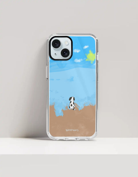 Hoomans Out of Office iPhone case — hand-painted spotted dog on a beach facing the sea, on iPhone 15 Plus mockup