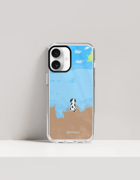 Hoomans Out of Office iPhone case — hand-painted spotted dog on a beach facing the sea, on iPhone 16 mockup