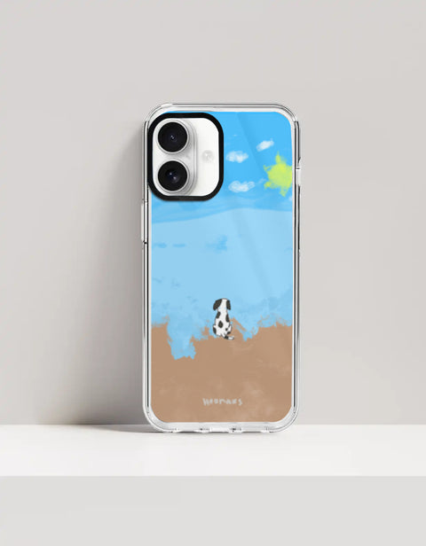 Hoomans Out of Office iPhone case — hand-painted spotted dog on a beach facing the sea, on iPhone 16 Plus mockup