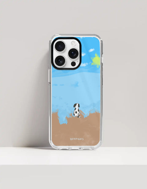 Hoomans Out of Office iPhone case — hand-painted spotted dog on a beach facing the sea, on iPhone 16 Pro Max mockup