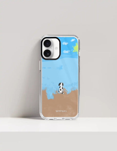 Hoomans Out of Office iPhone case — hand-painted spotted dog on a beach facing the sea, on iPhone 17 mockup