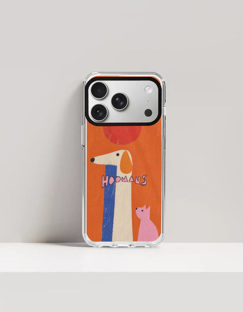 Hoomans Tall Dog Small Cat iPhone case: a very tall cream dog and a small pink cat on burnt orange with HOOMANS lettering, on iPhone 17 Pro mockup