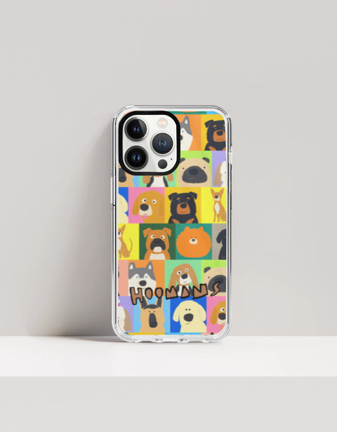 Hoomans Lotta Dogs iPhone case: colour-block grid of hand-drawn dog breed portraits with HOOMANS lettering, on iPhone 13 Pro mockup