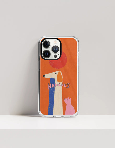 Hoomans Tall Dog Small Cat iPhone case: a very tall cream dog and a small pink cat on burnt orange with HOOMANS lettering, on iPhone 13 Pro mockup