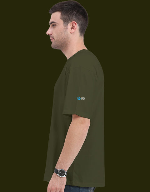 Dogesh Bhai Ki Gang oversized tee in olive green, side view with the Humane World for Animals India mark on the left sleeve