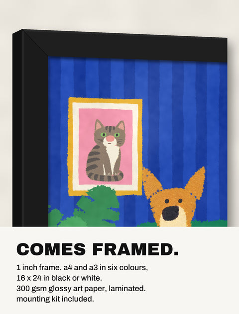 Corner of the black frame at an angle showing the Indie in the Armchair print inside
