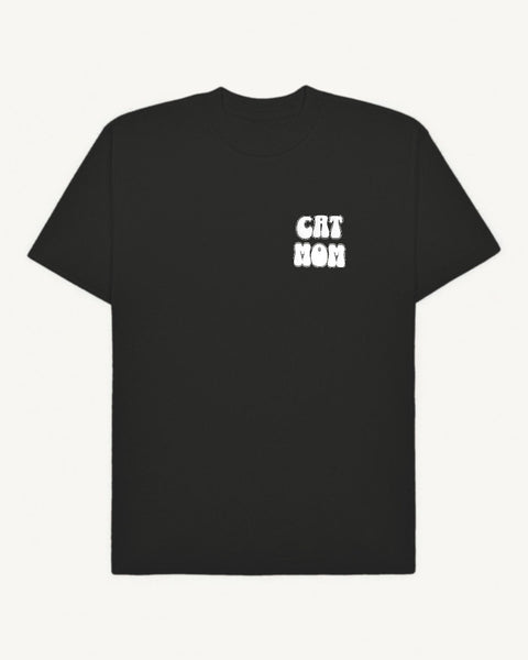 Black oversized tee with 'Cat Mom' white puff print on left chest, front flat lay