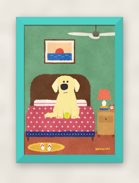 Labrador on the Bed art print in a teal frame on a plain wall