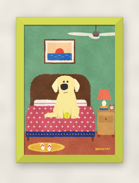 Labrador on the Bed art print in a lime frame on a plain wall