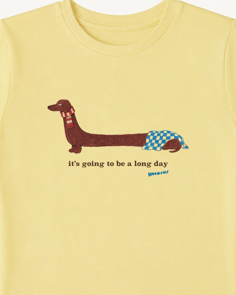 Close-up of the long dachshund print: front half up in a red scarf, back half asleep under a blue blanket, Hoomans