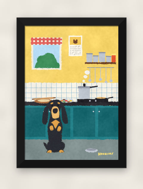 Dachshund in the Kitchen art print in a black frame on a plain wall, front view