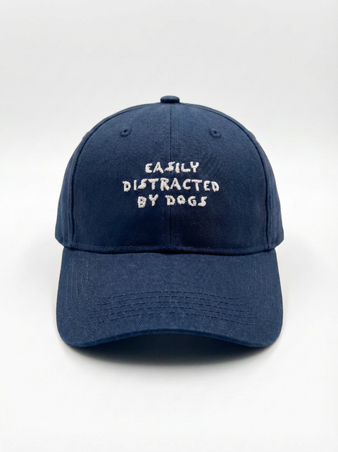 Easily Distracted by Dogs cap worn by model – red – Hoomans
