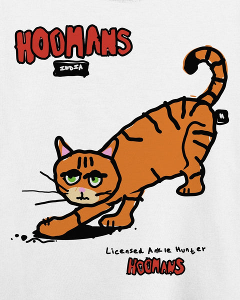 Close-up of the Ankle Hunter print: an orange striped cat crouched low with green half-lidded eyes, red hoomans lettering and Licensed Ankle Hunter in handwriting
