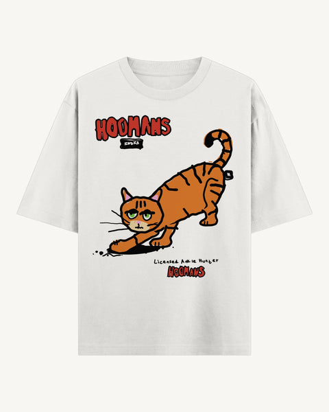 White oversized tee with an orange tabby cat in a stalking crouch, red hoomans logo and Licensed Ankle Hunter in handwriting, front flat lay