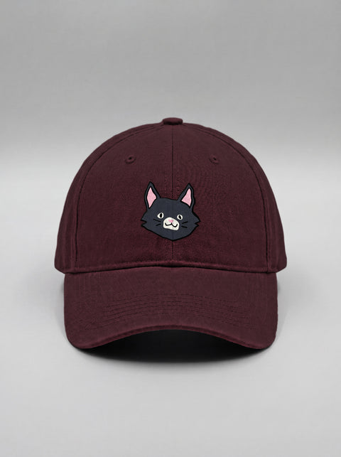 Maroon baseball cap with embroidered black cat face, front view