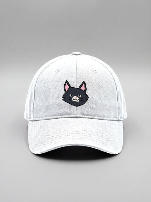 White baseball cap with embroidered black cat face, front view