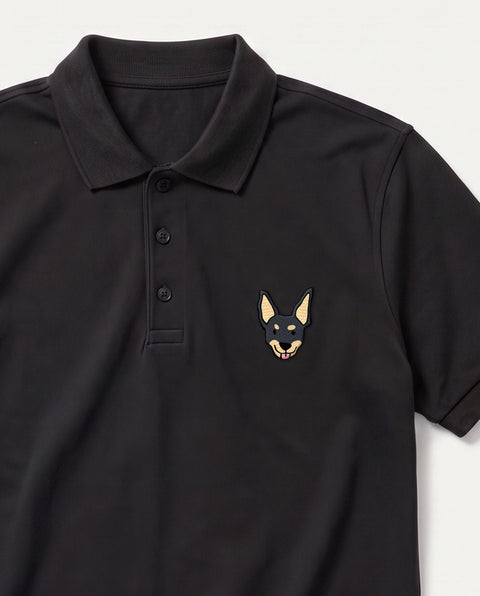 Black embroidered black indie dog polo, close-up of collar, button placket, and satin-stitch chest patch