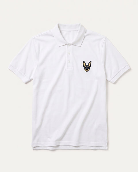 White polo shirt with embroidered black indie dog face on the chest, front flat lay
