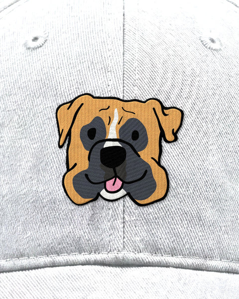 Embroidered boxer face in satin stitch on a white baseball cap, close up