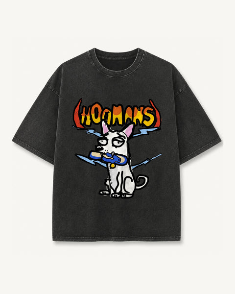 Black vintage wash oversized tee with a white dog holding a blue chappal in its mouth under a flaming hoomans logo with horns and blue lightning, front flat lay