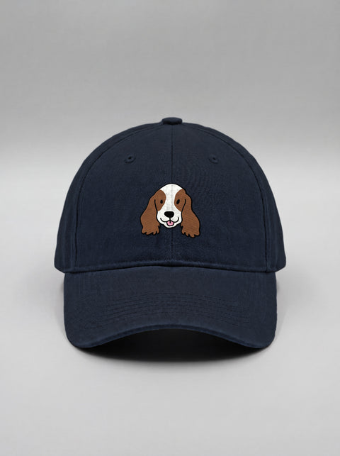Navy blue baseball cap with embroidered cocker spaniel face, front view