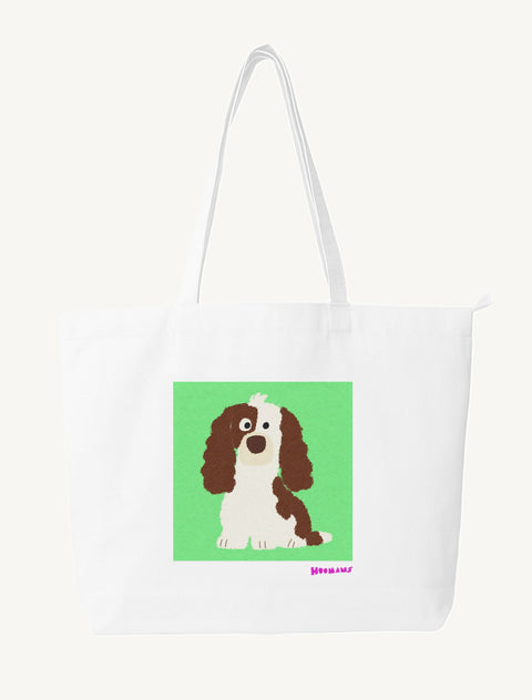 White large canvas tote bag with a flat colour brown and white Cocker Spaniel sitting on a mint green block and an orchid Hoomans wordmark, front view