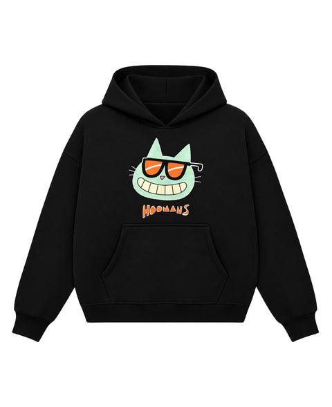 Black boxy hoodie with a mint green cartoon cat in orange sunglasses with a wide toothy grin above an orange HOOMANS wordmark, front flat lay