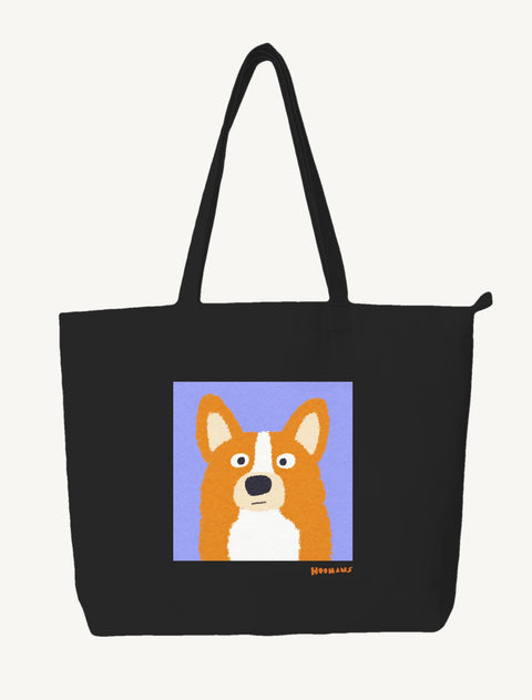 Black large canvas tote bag with a flat colour Corgi face on a periwinkle block and a ginger Hoomans wordmark, front view