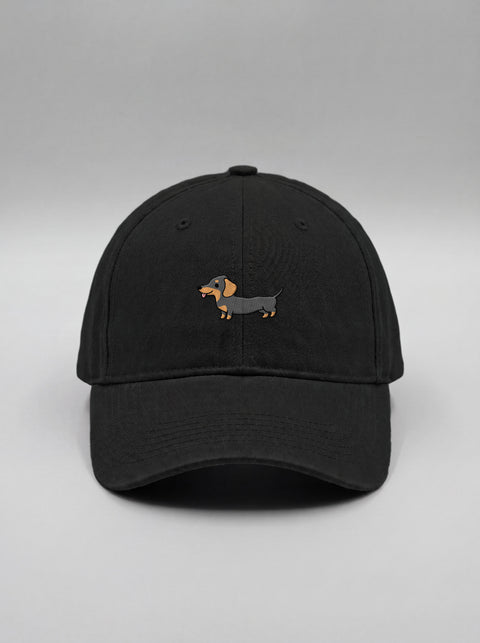 Black baseball cap with embroidered full-body dachshund, front view