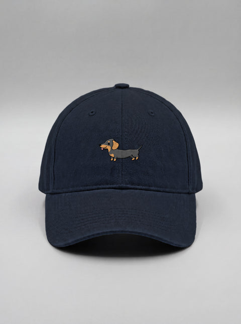 Navy blue baseball cap with embroidered full-body dachshund, front view