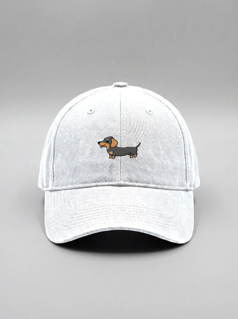 White baseball cap with embroidered full-body dachshund, front view