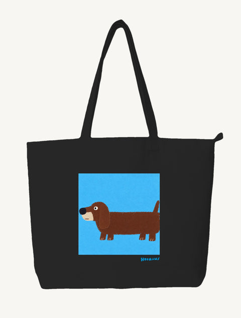Black large canvas tote bag with a flat colour Dachshund on a sky blue block and a blue Hoomans wordmark, front view