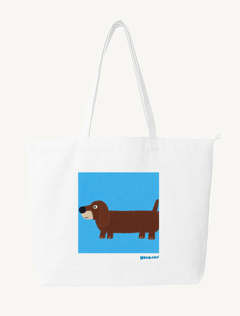 White large canvas tote bag with a flat colour Dachshund on a sky blue block and a blue Hoomans wordmark, front view