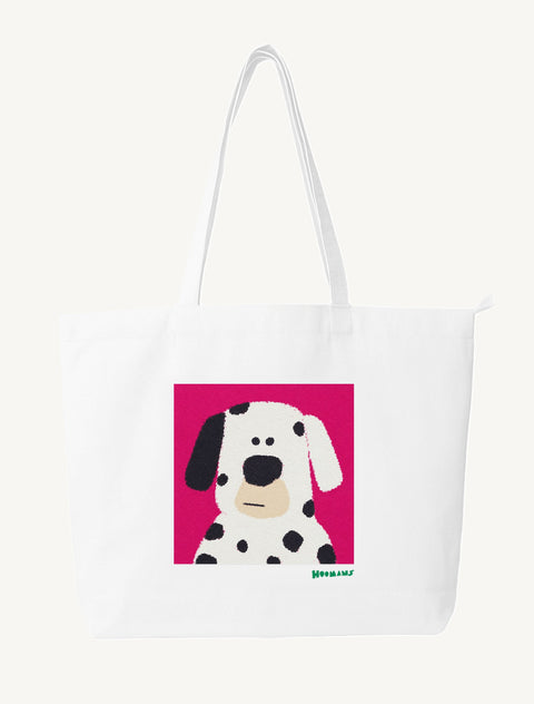 White large canvas tote bag with a flat colour spotted Dalmatian on a magenta block and an emerald green Hoomans wordmark, front view