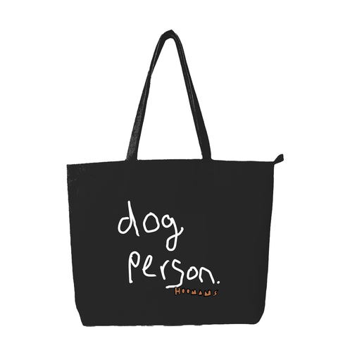 Dog Person black cotton tote bag with dog person hand lettered in white and a brown HOOMANS signature