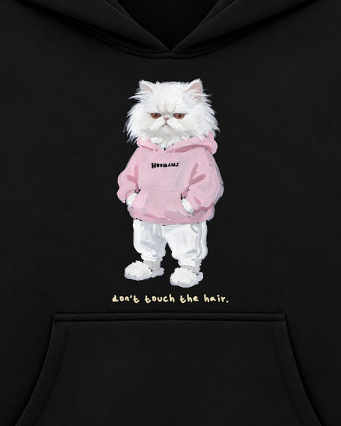 Close up of the chest print: a grumpy white persian in a pink HOOMANS hoodie above 'don't touch the hair.'
