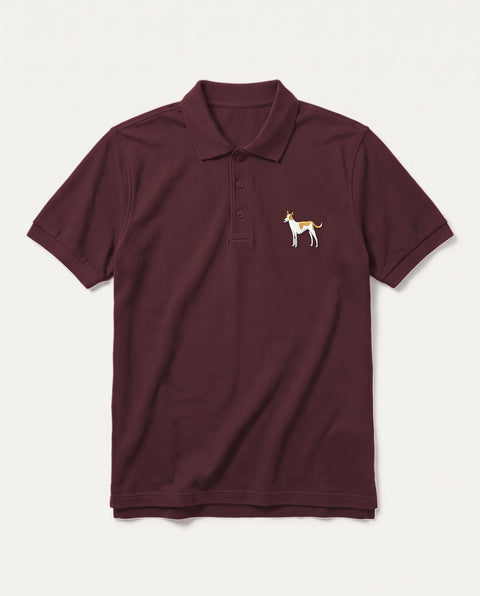 Maroon polo shirt with embroidered full-body indie dog on the chest, front flat lay