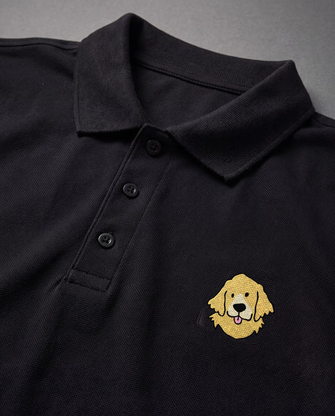 Black embroidered Golden Retriever polo, close-up of collar, button placket, and satin-stitch chest patch