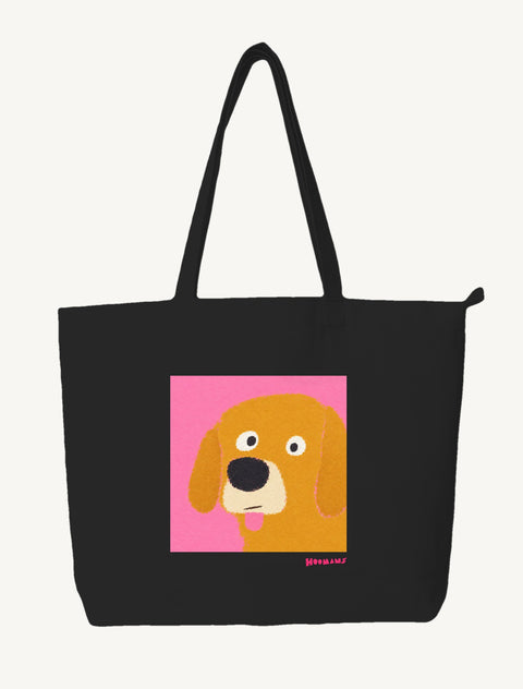 Black large canvas tote bag with a flat colour Golden Retriever face on a hot pink block and a pink Hoomans wordmark, front view