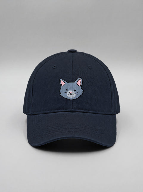 Navy blue baseball cap with embroidered grey cat face, front view