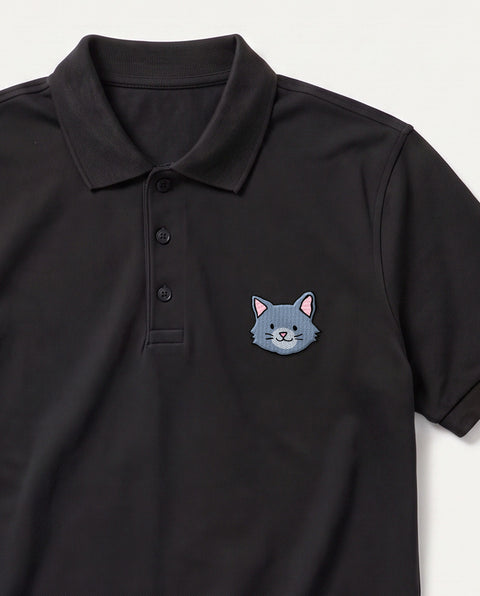 Black embroidered grey cat polo, close-up of collar, button placket, and satin-stitch chest patch