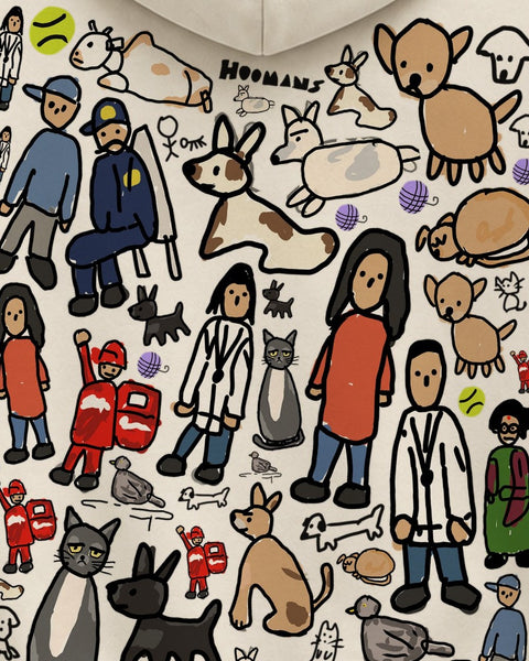 Close up of the back: colony characters, a tennis ball and the HOOMANS wordmark on cream fleece