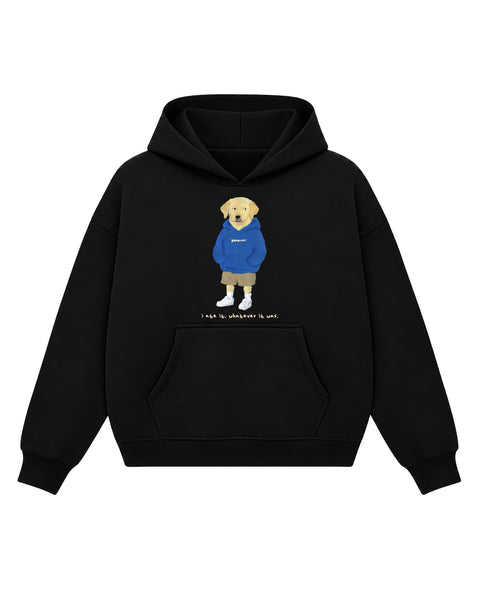 Black boxy hoodie with a painted yellow labrador in a cobalt hoodie and khaki shorts licking its lips above the line 'i ate it. whatever it was.', front flat lay